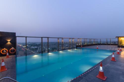 a swimming pool on the roof of a building at Holiday Inn Chandigarh Zirakpur by IHG in Chandīgarh