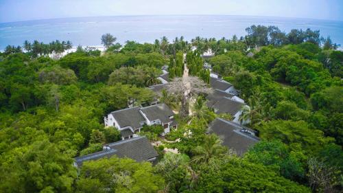 an aerial view of a house in the trees at Pinewood Beach Resort and Spa in Diani Beach