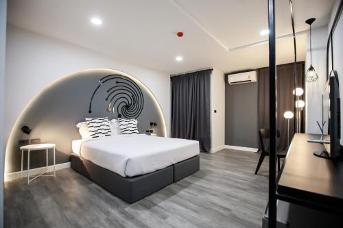 Cama o camas de una habitación en SR Grand Hotel Chiangmai