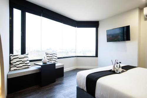 Ένα ή περισσότερα κρεβάτια σε δωμάτιο στο SR Grand Hotel Chiangmai
