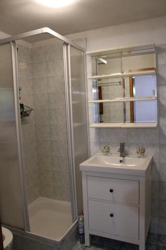 a bathroom with a shower and a sink at Alamari in Sala