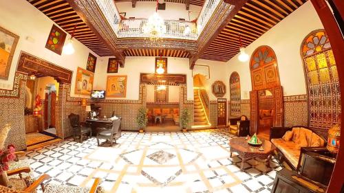 a large living room with a large ceiling and a large floor at Riad Las Mil y una Noches Tetuan in Tetouan
