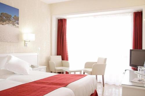 Hotel Bella Playa & Spaにあるベッド