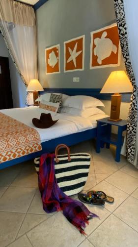 a bedroom with a bed at Pinewood Beach Resort and Spa in Diani Beach