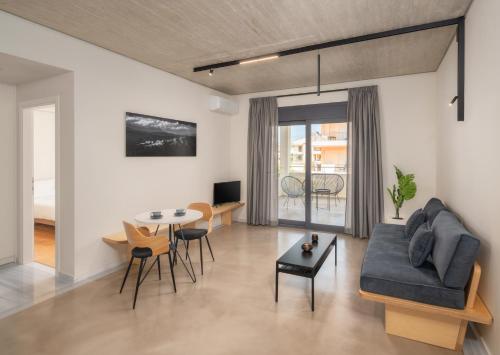 a living room with a couch and a table at ASTRA IN CITY in Ioannina