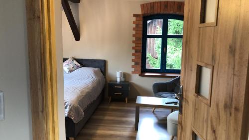 Ein Bett oder Betten in einem Zimmer der Unterkunft Wilaneska Prośno