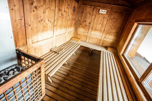an inside view of a wooden cabin with a staircase at Sertorelli Sporthotel in Breuil-Cervinia