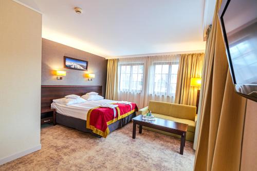 Hotel Kryształ Conference & Spaにあるベッド