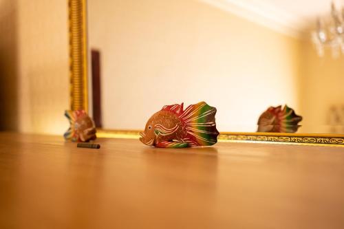 a figurine of a dragon in front of a mirror at The Hill Hotel in Dumfries