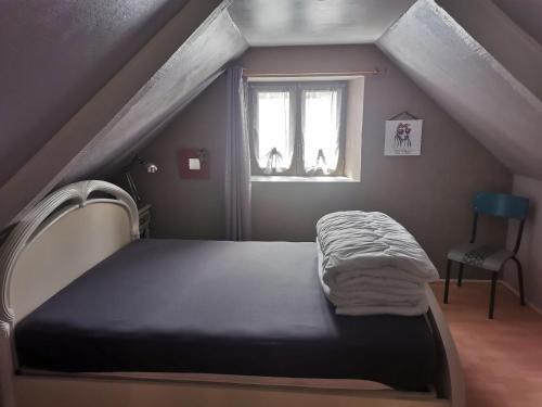 Кровать или кровати в номере Gîte du Kreizker