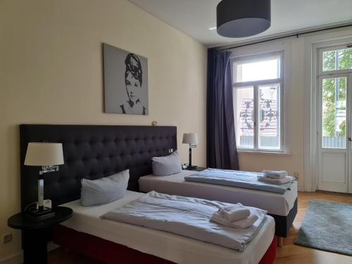 Postel nebo postele na pokoji v ubytování Cityappartement am Theaterplatz
