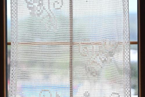 a window with a view of a city at Garni HinYard in Garni