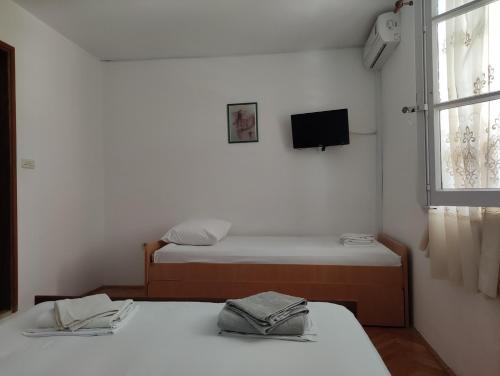 Posteľ alebo postele v izbe v ubytovaní Apartmani Selak, Makarska