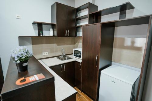Kuchyň nebo kuchyňský kout v ubytování West Apart Hotel
