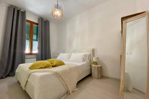 En eller flere senge i et værelse på Oasi Vacation Rental