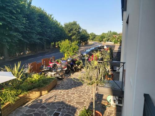 a group of motorcycles parked on the side of a street at Hotel La Passeggiata in Desenzano del Garda