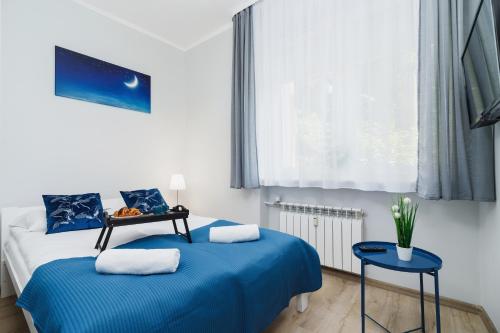 Posteľ alebo postele v izbe v ubytovaní Apartment Smoluchowskiego Cracow by Noclegi Renters