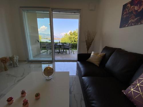 a living room with a couch and a table at Amadeus in Baveno