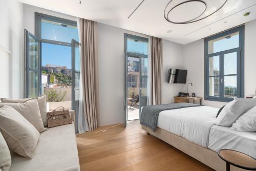 Postel nebo postele na pokoji v ubytování Hellenic Vibes Smart Hotel