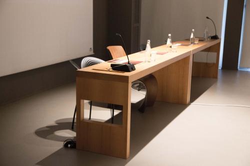 a desk with a chair in a room at Point Hotel in Piove di Sacco