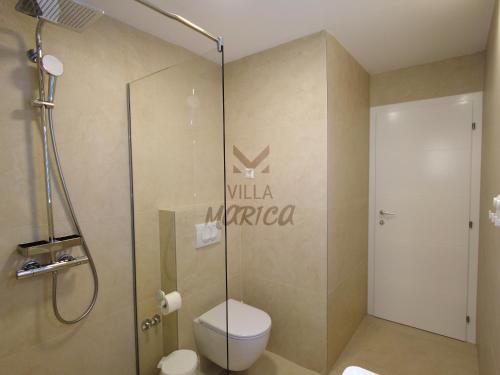 a bathroom with a toilet and a shower at Villa Marica Šipovo in Šipovo