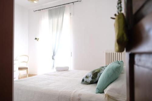 מיטה או מיטות בחדר ב-La Residenza dei Nonni