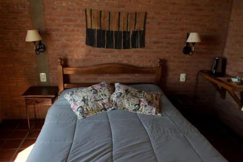 Una cama o camas en una habitación de Posada Larsen