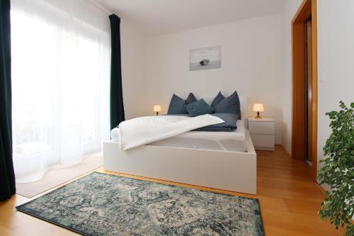 Postel nebo postele na pokoji v ubytování Steira-Studios Leibnitz