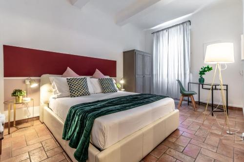 a bedroom with a large bed in a room at Wine Apartments Florence Ansonica in Florence