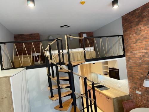 Kuchyň nebo kuchyňský kout v ubytování Apartamenty MGA Lividus 15