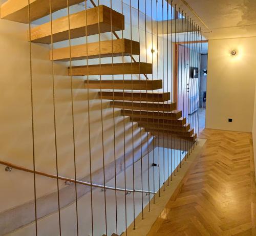 a staircase in a house with metal railings at Oporto CoLiving Monte Ramalde in Porto