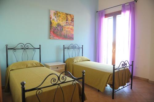 Postel nebo postele na pokoji v ubytování Agriturismo Mele