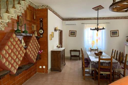 a living room with a table and a dining room at Casa Graziana in Terni
