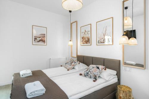 Posteľ alebo postele v izbe v ubytovaní Apartments Na Podgórniku by Renters Prestige