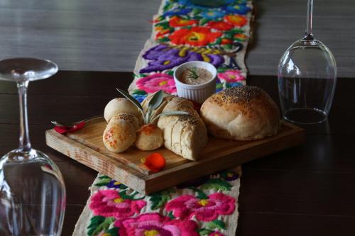 a tray of bread on a table with a wine glass at Real de Corralejo in San Miguel de Allende