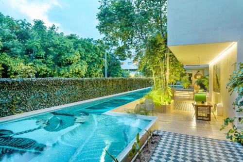a swimming pool in the middle of a house at 305 Luxury Penthouse with Private Pool in Tulum