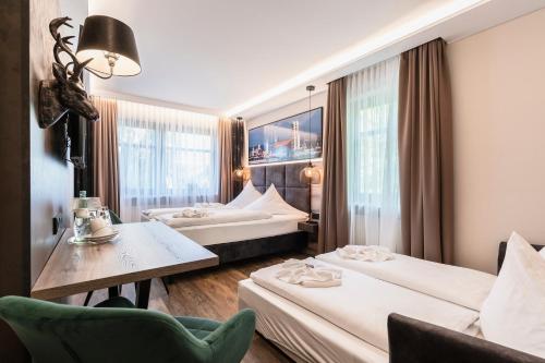 Postel nebo postele na pokoji v ubytování Hotel Demas München-Unterhaching