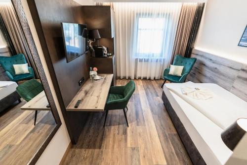 Ένα ή περισσότερα κρεβάτια σε δωμάτιο στο Hotel Demas München-Unterhaching