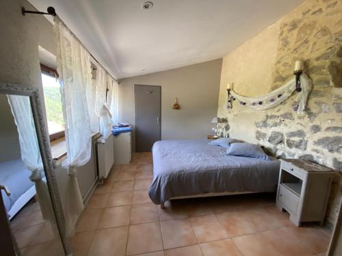 Ένα ή περισσότερα κρεβάτια σε δωμάτιο στο Domaine de la Tuillière