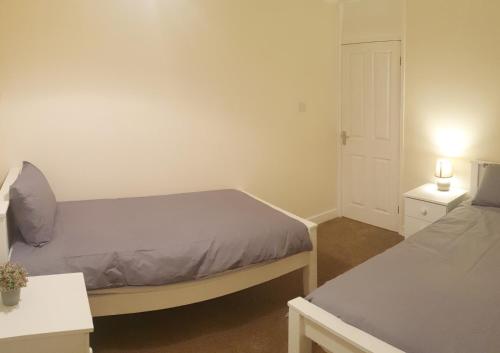 A bed or beds in a room at Gregory Place