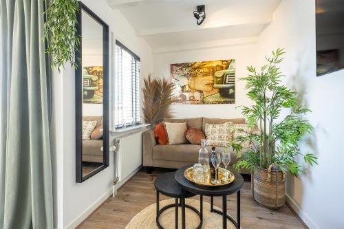 a living room with a couch and a table at Zandvoort-17 in Zandvoort