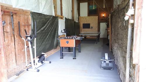 a room with a ping pong table and a table at Ferienhaus Monika in Gutschau