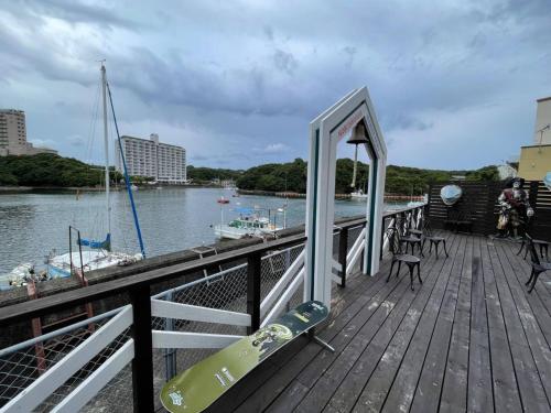 a wooden dock with a boat on the water at Marina Hotel Kaikuu - Vacation STAY 58502v in Kanayama