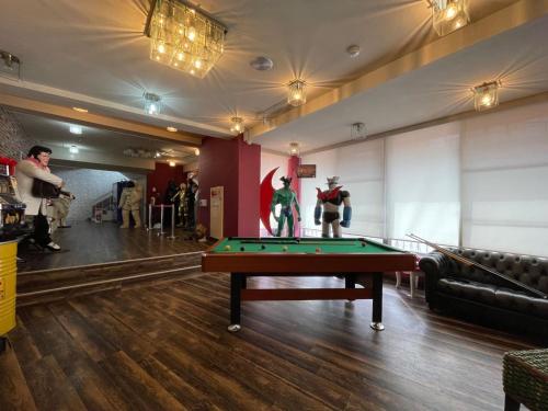 a billiard room with a pool table and two superheroes at Marina Hotel Kaikuu - Vacation STAY 58502v in Kanayama