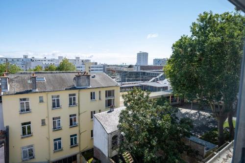 a view of a city from a building at Le Poulorio 12 - T2 - Proche Gare - dernier étage By Locly in Lorient