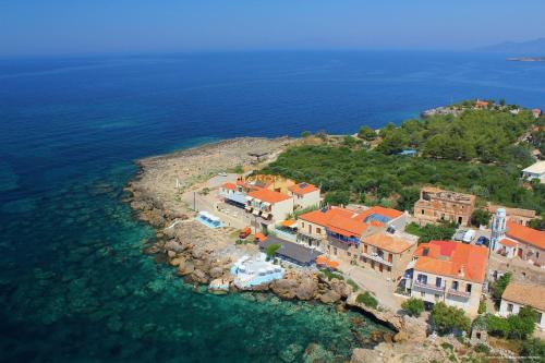 an aerial view of a house on the shore of the ocean at FAROS in Agios Nikolaos