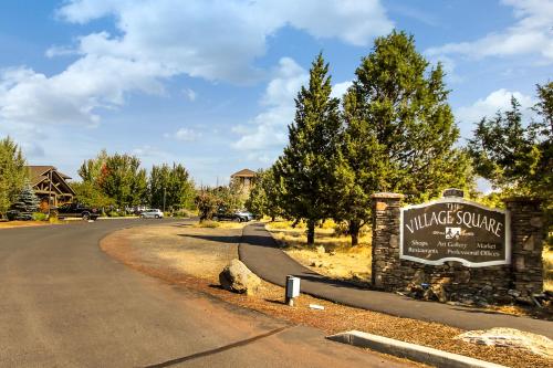 a sign for avillage sound resort with a road at Eagle Crest Family Friendly Chalet in Redmond