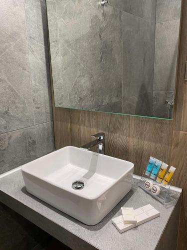 a white sink on a counter in a bathroom at 11 Luxury Apartments in Metsovo