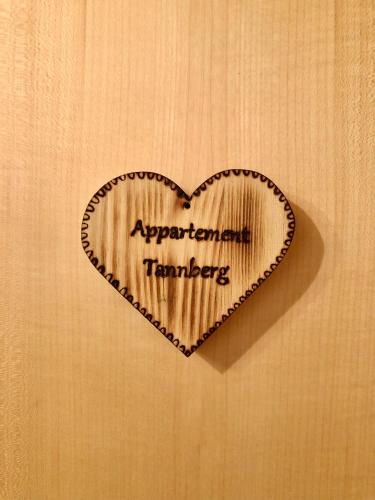a wooden heart with the wordsresponderateerateerateerateerateerateerateuclearuclear at Appartements Willi in Schoppernau