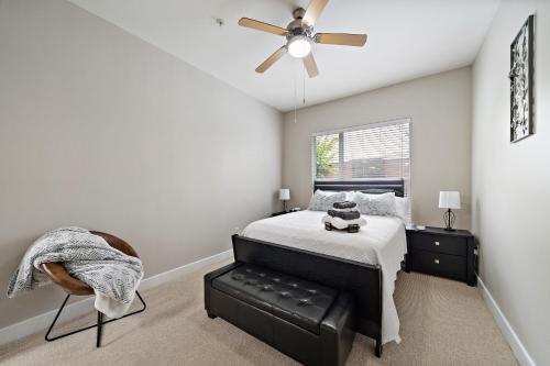 a bedroom with a bed and a ceiling fan at Corporate rental unit City Centre, Energy Corridor in Houston
